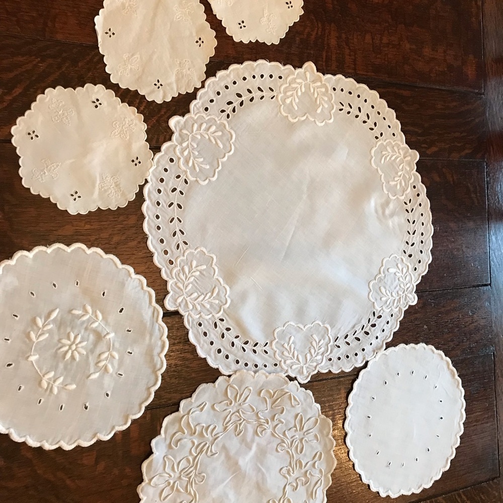 6 vintage linen embroidered rounds. Largest is 15” great condition, no stains.